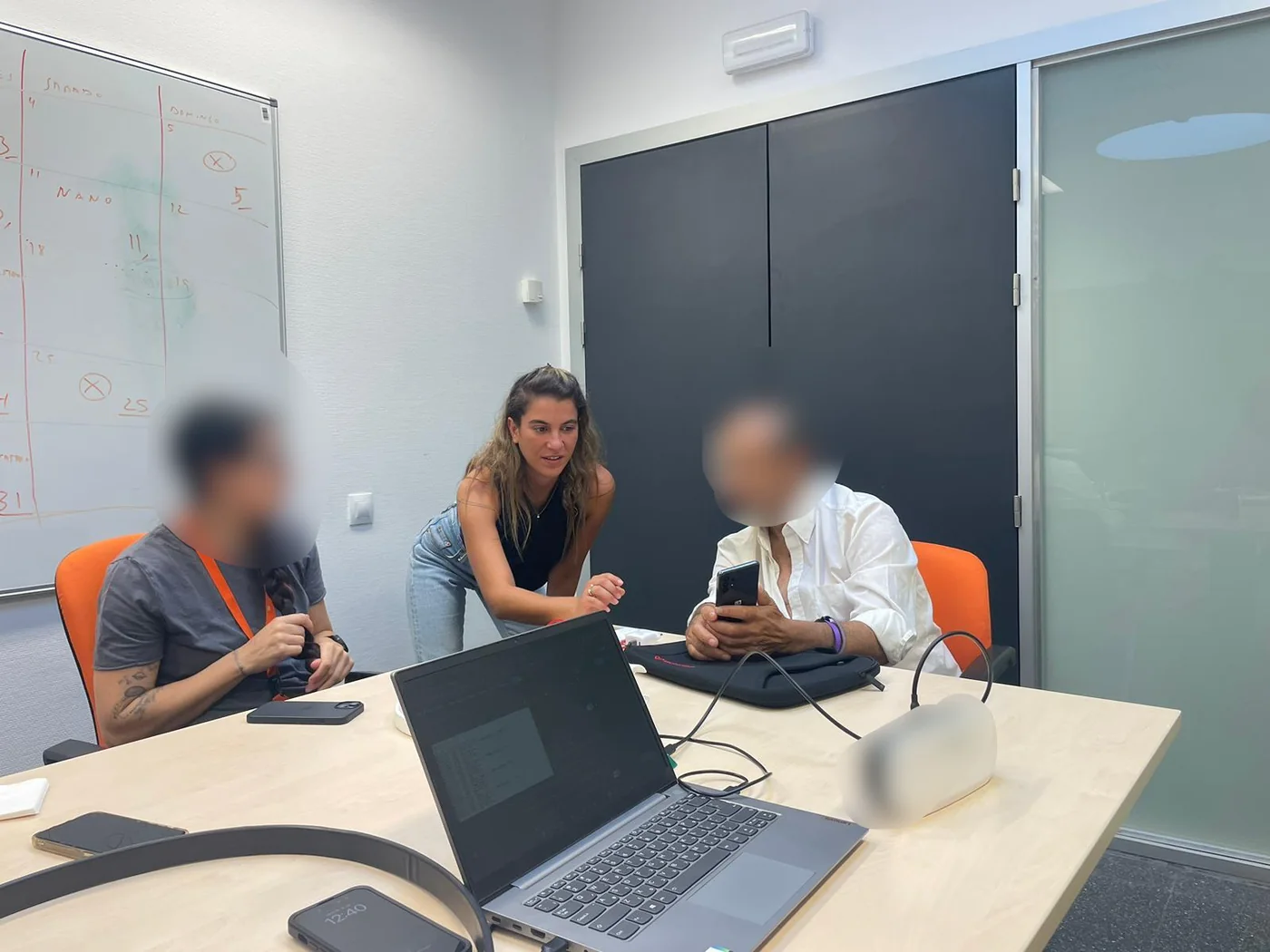 Raz guiding a usability session with a participant holding the app
