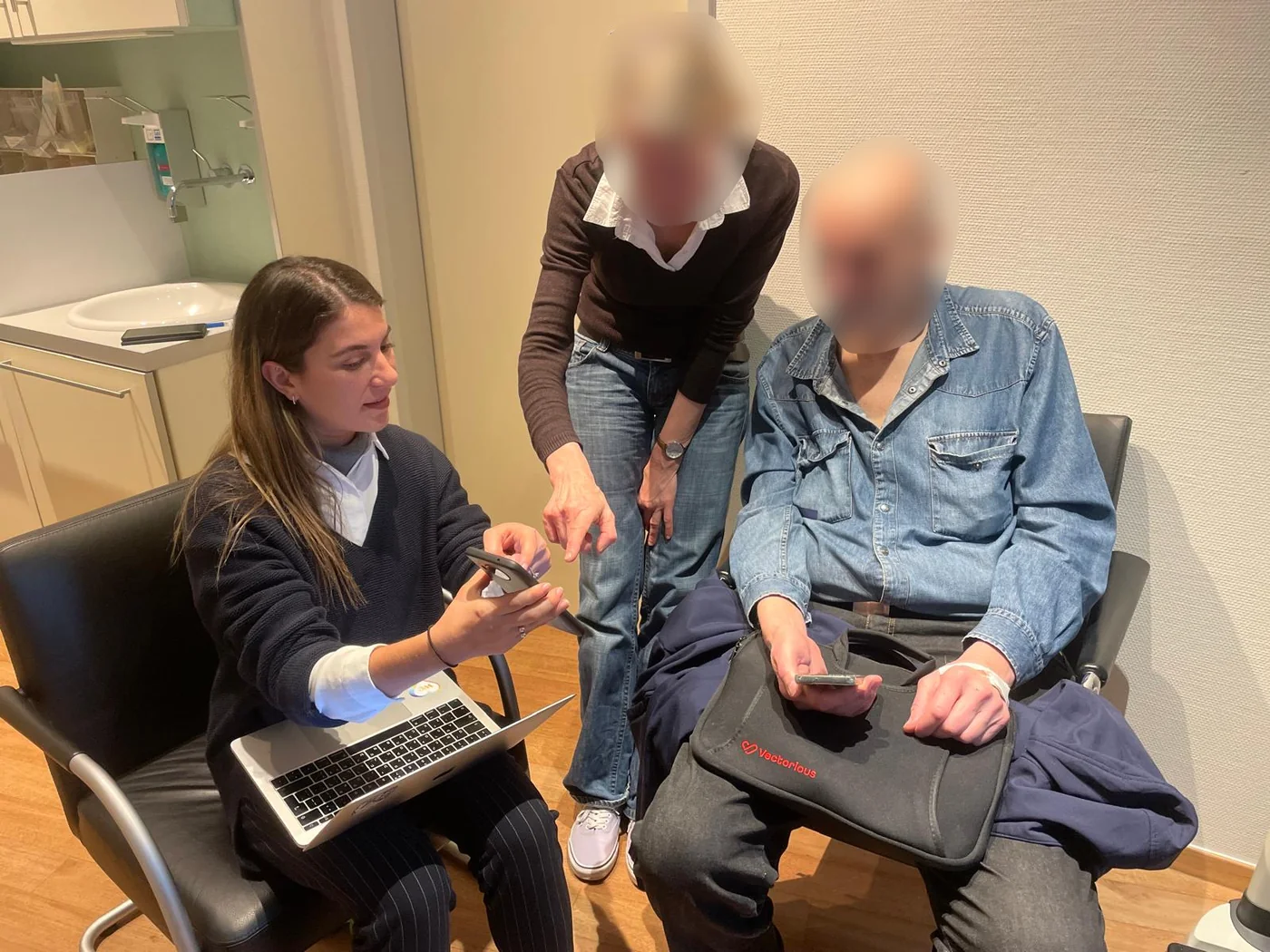 Raz testing the app with a patient and a clinician in a clinic