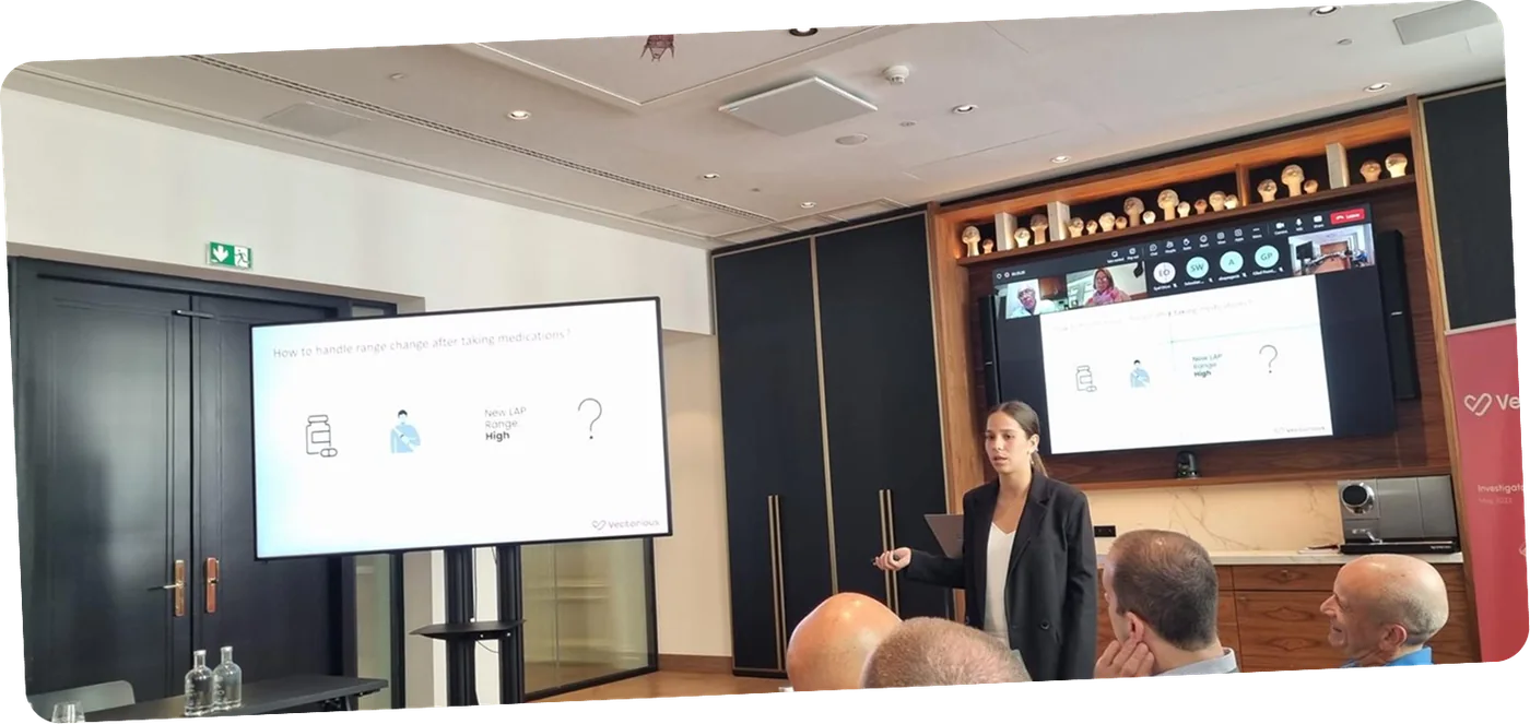 Raz presenting research findings to clinicians and investigators