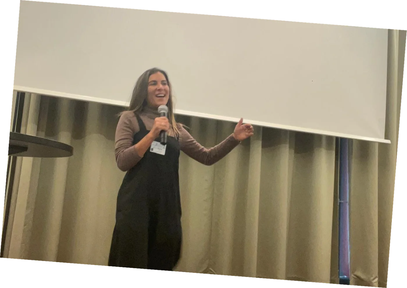 Raz speaking on stage at the UI/UX Healthcare conference in Berlin